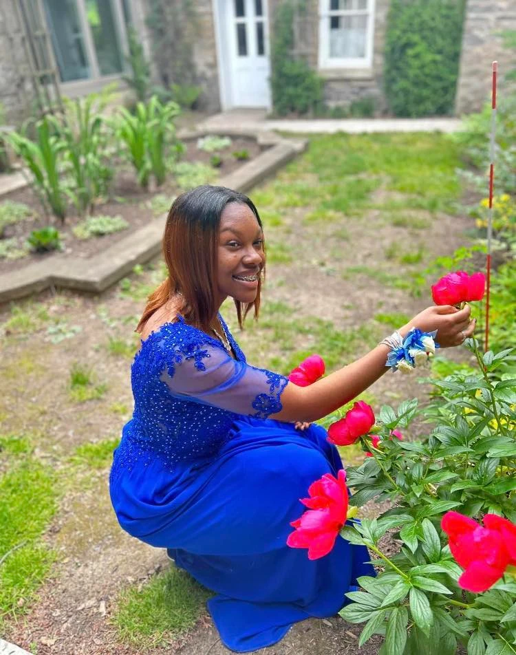 Royal blue prom dress in garden setting
