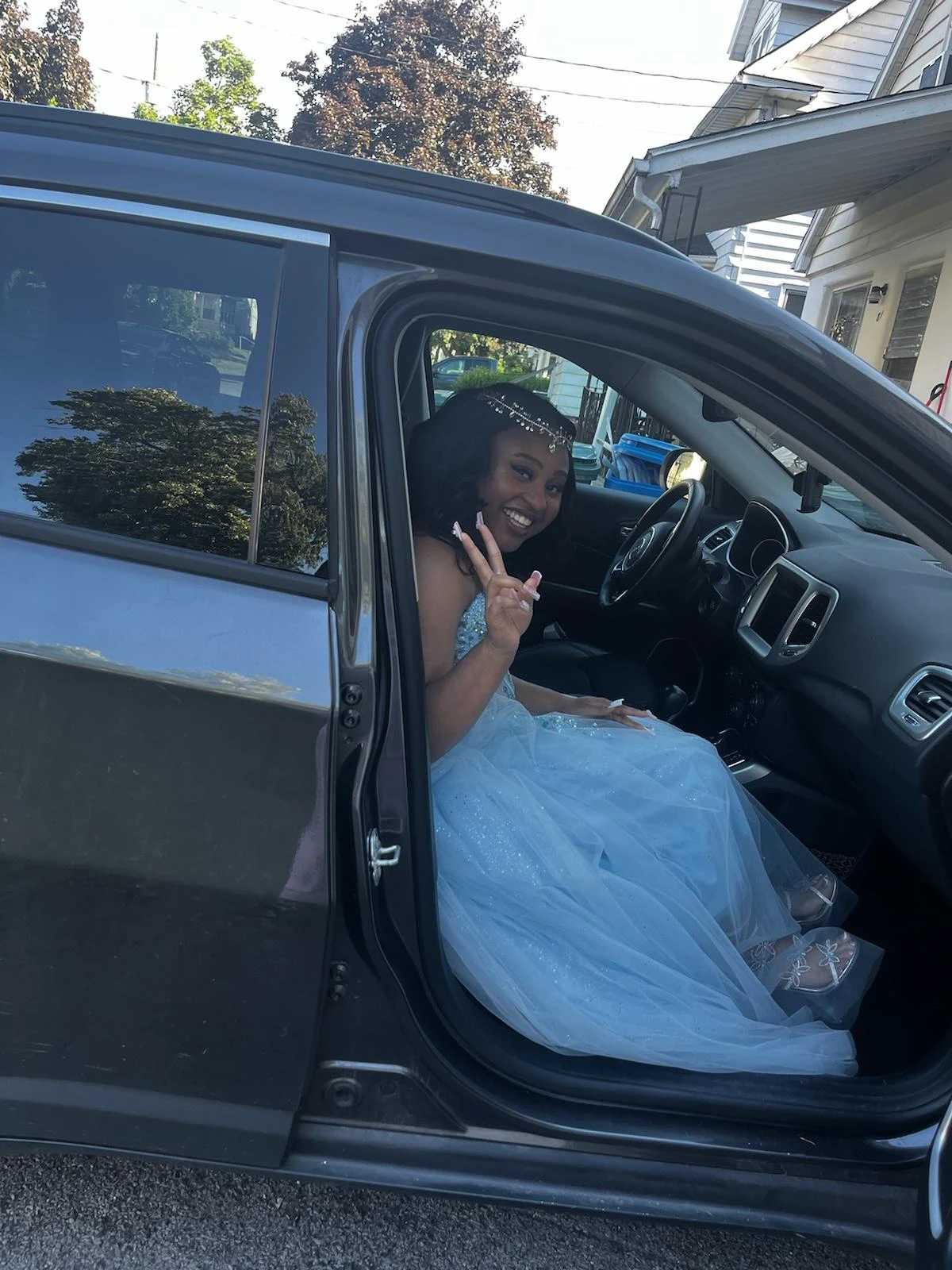 Happy prom girl in blue dress heading to the dance