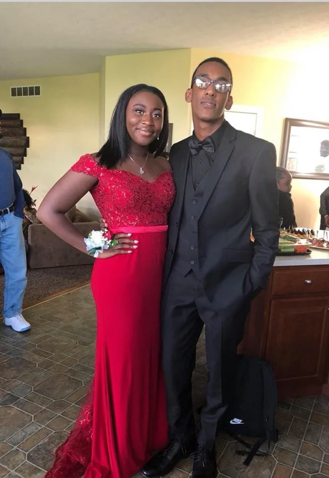 Prom couple with elegant red lace dress styled by Shannette