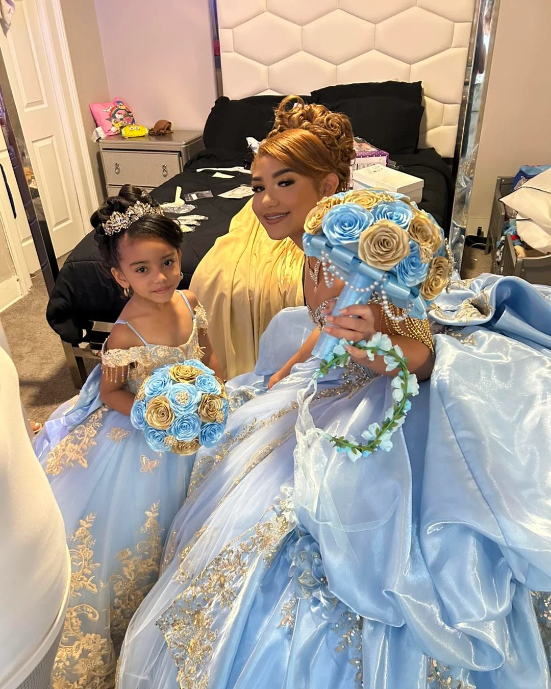 Quinceañera celebration with matching blue and gold gowns styled by Shannette